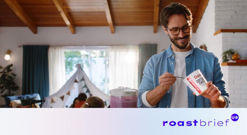 Man putting Daisy Cottage Cheese into a blender to make purple smoothie.