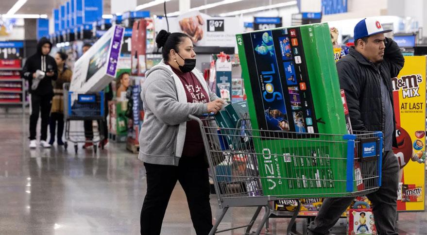 Shoppers buy televisions and other goods at a Walmart store in November 2022 in Dunwoody, Georgia.